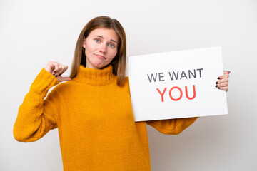 Young English woman isolated on white background holding We Want You board with proud gesture