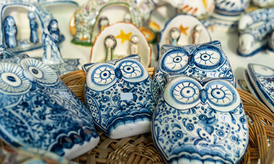 Wall Mural - Stall with azulejo style Portuguese ceramic owls, traditional local handicrafts from Portugal.