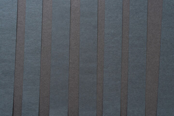 Wall Mural - black paper stripes on dark gray paper board