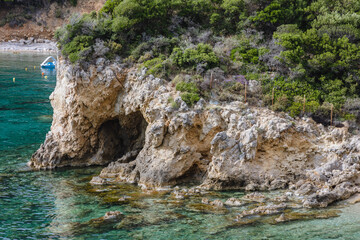 Wall Mural - Rocky coast near Agios Petros beach in Palaiokastritsa village, Corfu Island, Greece