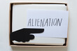 © eugen - index card with the word 'alienation' and a pointing finger