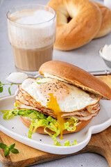 Wall Mural - Turkey bagel breakfast sandwich with lettuce and fried egg