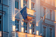 © Vladyslav - EU flag on government building, illuminated EC flag