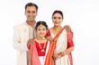 Portrait of happy bengali family in traditional clothing on occasion of durga puja celebration
