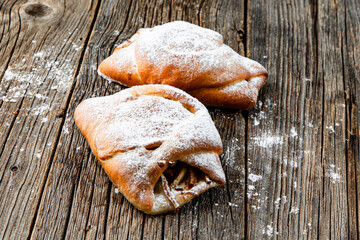 Wall Mural - Freshly baked sweet buns on wood table