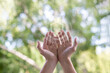 © natali_mis - Hands support medical sign on blur background.