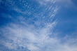 Bright and intense blue sky with white altocumulus clouds perfect for backgrounds and graphic resources