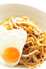 Wall Mural - Chinese food, carrot and soy sprout with pork fried noodles served with sunny side up fried egg