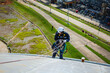 © chitsanupong - Male worker inspection wearing safety first harness rope safety line working at a high place on tank roof spherical