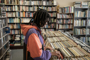 Wall Mural - Woman searching through vinyl records