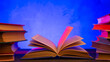 Leinwandbild Motiv Wisdom and education concept.Book on the table, love reading. Retro neon light 90s