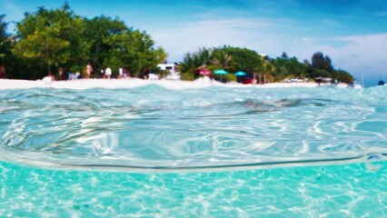 Wall Mural - Tropical blue sea with island. Splitted view of the tropical island and the sea in the Maldives