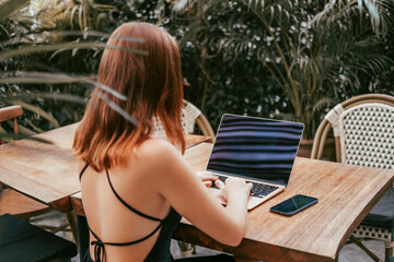 Pretty Young Beauty Woman Using Laptop in cafe, outdoor portrait business woman, hipster style, internet, smartphone, office, Bali Indonesia, holding, mac OS, manager, freelancer 