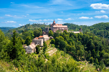 Wall Mural - Outdoor view of Pernstejn castle near the Nedvedice village, Czech Republic. Fairytale castle on hill during summer day. Big stone walls and towers.