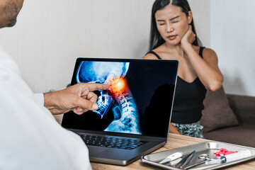 Doctor showing a x-ray of pain in the neck. Migraine Headache and backache. Woman patient in the background