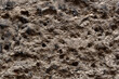 Background of gray porous sandstone.