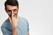© SHOTPRIME STUDIO - portrait man in blue t-shirt glasses for vision smile emotions cropped view