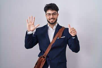 Sticker - Hispanic man with beard wearing business clothes showing and pointing up with fingers number six while smiling confident and happy.