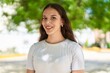 © Krakenimages.com - Young woman smiling confident standing at park