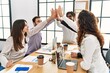 © Krakenimages.com - Group of business workers smiling happy celebrating with hands together at the office.