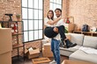 © Krakenimages.com - Man and woman couple smiling confident hugging each other at new home