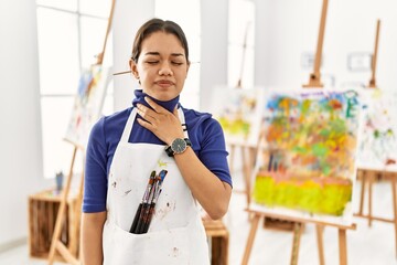 Sticker - Young brunette woman at art studio touching painful neck, sore throat for flu, clod and infection