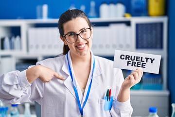 Sticker - Young brunette woman working on cruelty free laboratory pointing finger to one self smiling happy and proud