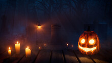 Halloween Scene With Ghostly Moonlit Gravestones And Illuminated Pumpkin.