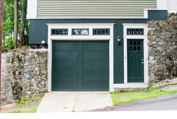 Wall Mural - One car Garage Door with additional Door entrance, both painted in black color