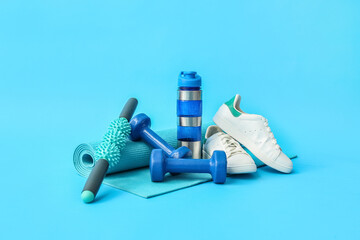 Wall Mural - Set of sports equipment, shoes and bottle of water on color background