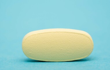 Wall Mural - medical pill isolated on color background