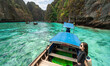 Beautiful women relax on the boat in Beautiful sea and blue sky at Phi phi island