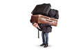 Man carrying a lot of heavy luggage on his back