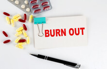 BURN OUT Text Written In A Card With Pills. Medical Concept.