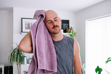 Man Wiping Head With Towel At Home