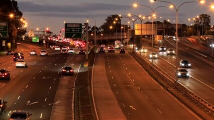 Poster - Multi-level intersection of Motorway in Sydney city at sunset – timelapse 4k.
