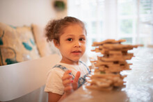 Portrait Cute Girl Playing With Wood Puzzle Pieces