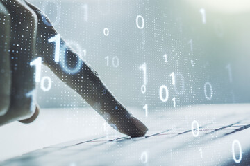 Wall Mural - double exposure of creative abstract binary code hologram and hands typing on laptop on background. 