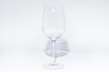 Wall Mural - Empty glass of wine on white background