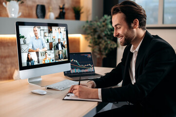 Sticker - Successful positive Caucasian business man in suit, sit at a workplace, negotiating with partners by video call , discussing new project, terms of cooperation, takes notes. Video conference in office.