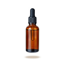 Dark Brown Glass Bottle Of Face Serum Or Essential Oil Or Pharmaceutical Tincture Isolated On White