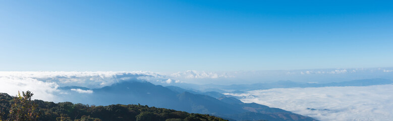 Wall Mural - Kiew Mae Pan Viewpoint, Chom Thong District in Chiang Mai on Doi Inthanon with beautiful views of Blue sky and clouds on the weather day, mountains and grass, and nature mist in winter.