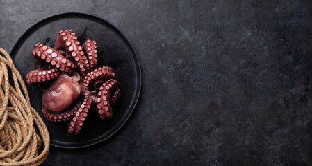 Canvas Print - Tasty octopus on black background