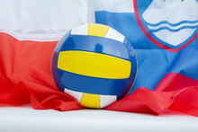 Volleyball Ball With Flags Of Poland And Slovenia, Host Countries Of Volleyball World Championship Tournament In 2022. World Cup Sport Background.