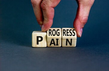 Wall Mural - Pain or progress symbol. Concept words Pain or Progress on wooden cubes. Businessman hand. Beautiful grey table grey background. Business and pain or progress concept. Copy space.