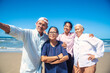 Group of asian seniors man and women happy time on the beach