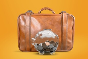 Poster - Travel.Vacation money saving concept, piggy bank beach vacation. Miniature luggage