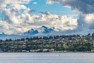 city of campbell river with golden hinde mountains behind taken from discovery passage on cruise shi