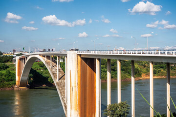 Wall Mural - Friendship Bridge (Portuguese: Ponte da Amizade ) over the Parana river, connecting Foz do Iguacu, Brazil, to Ciudad del Este in Paraguay.	
