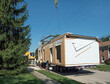 Readying Modular Home to be Lifted off Flatbed 